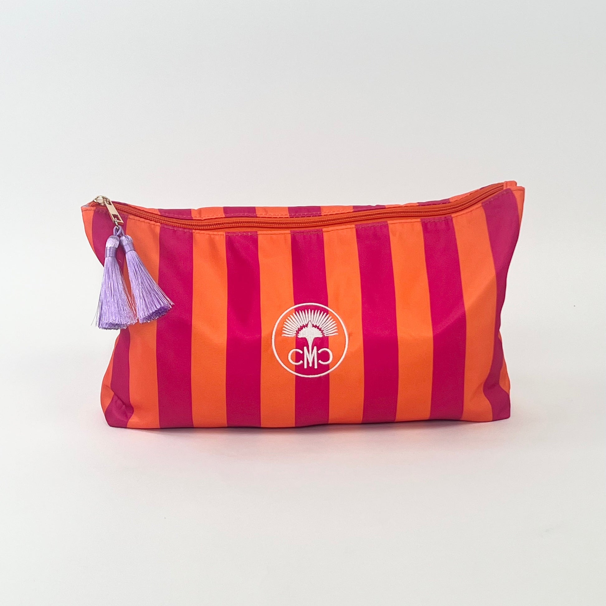 Orange and Pink Striped pouch with light purple tassels with a white logo on a white background