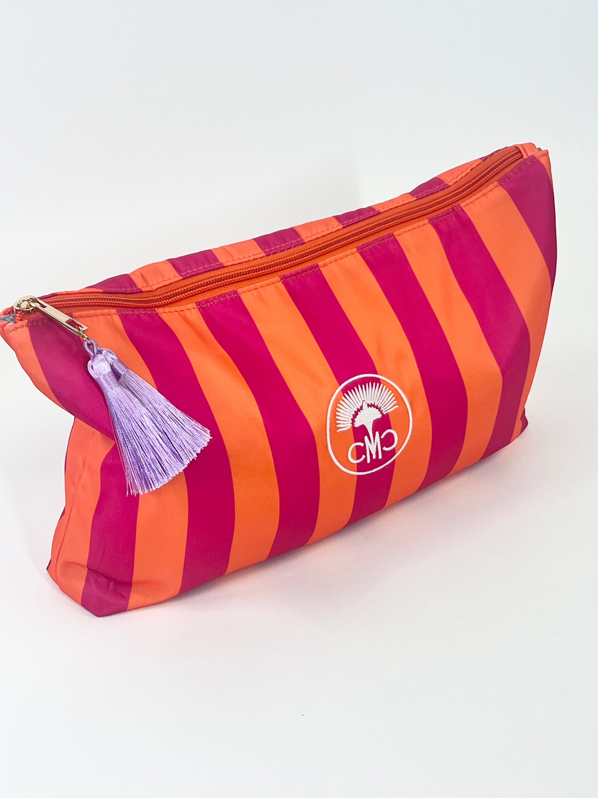 Striped pouch with a tassel on a white background