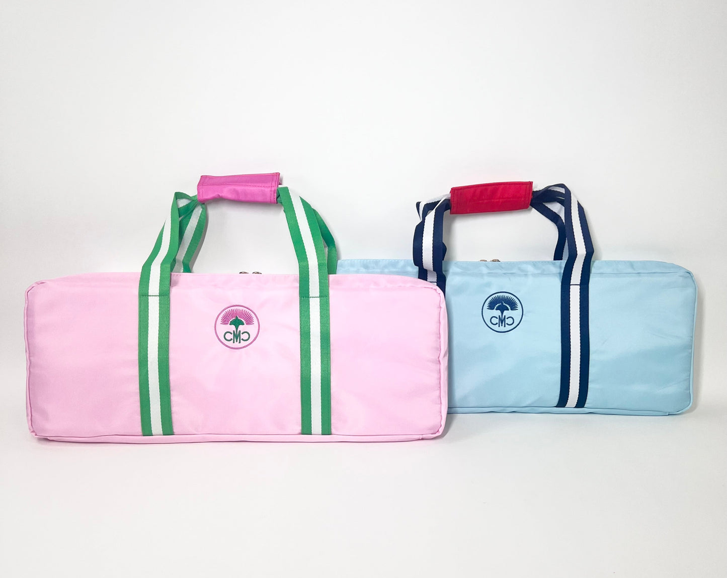 Two colorful rack bags with striped designs on a white background