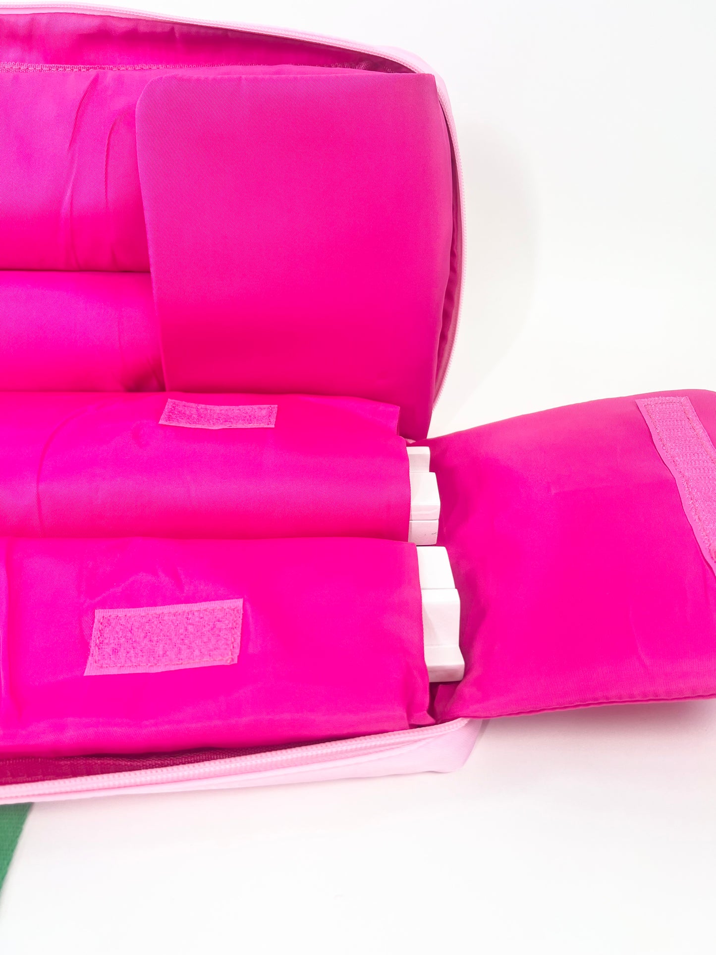 Pink rack bag interior with racks in pockets on a white background