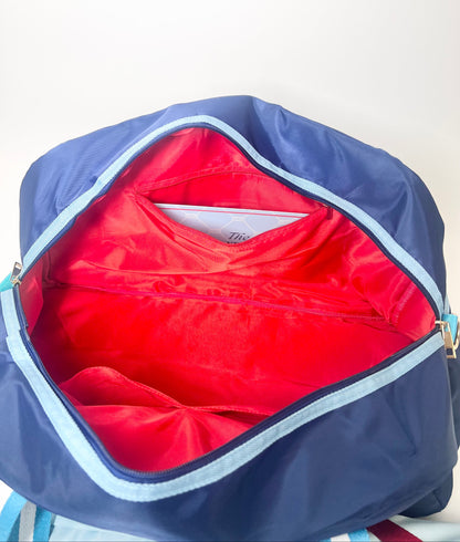 Open blue bag with red interior on a white background