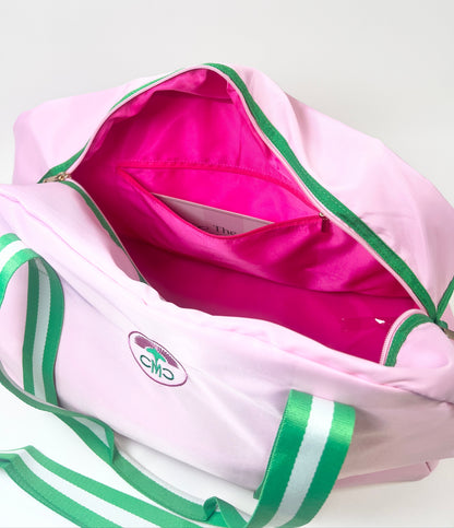 Pink and green bag showing hot pink interior with pockets